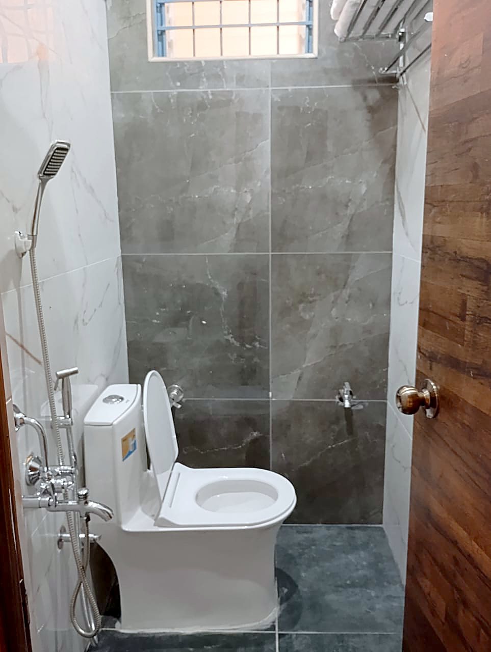 Queen Room bathroom with shower and western toilet