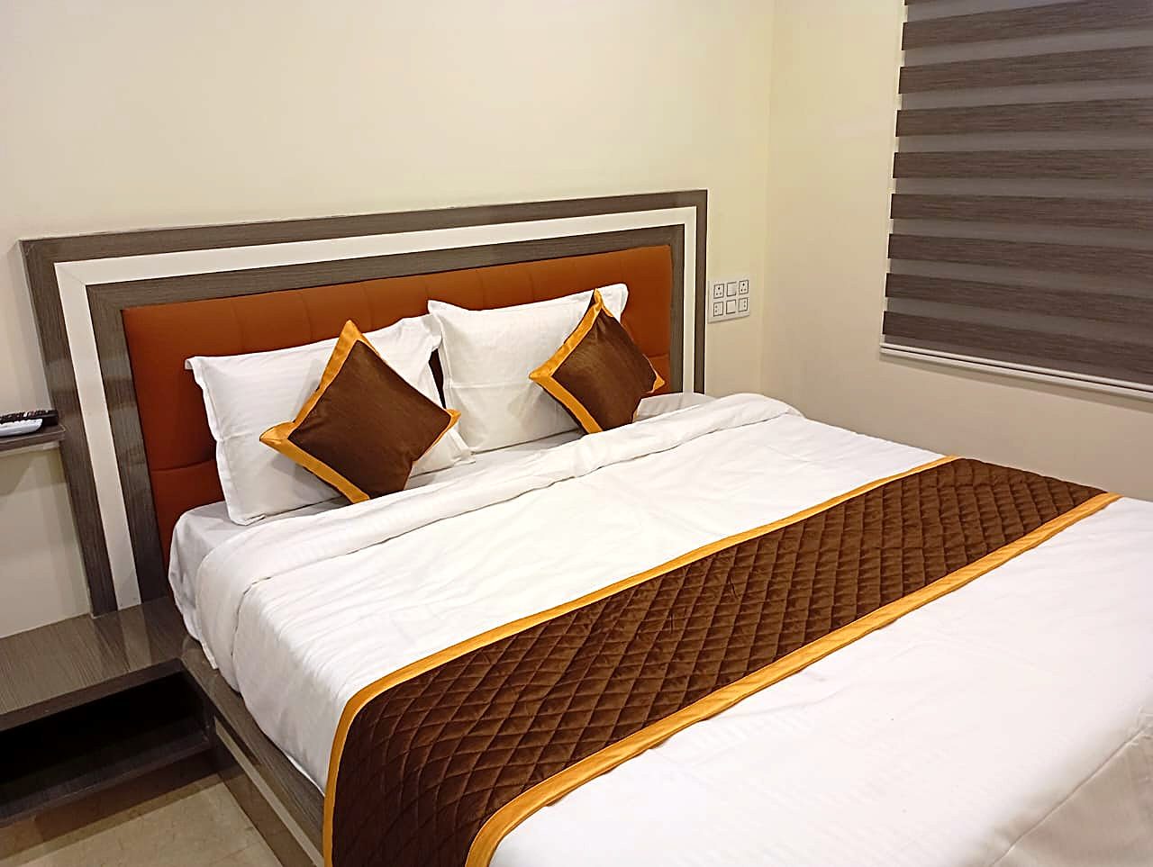 King Room at Aadya Inn Tirupati with a king-size bed