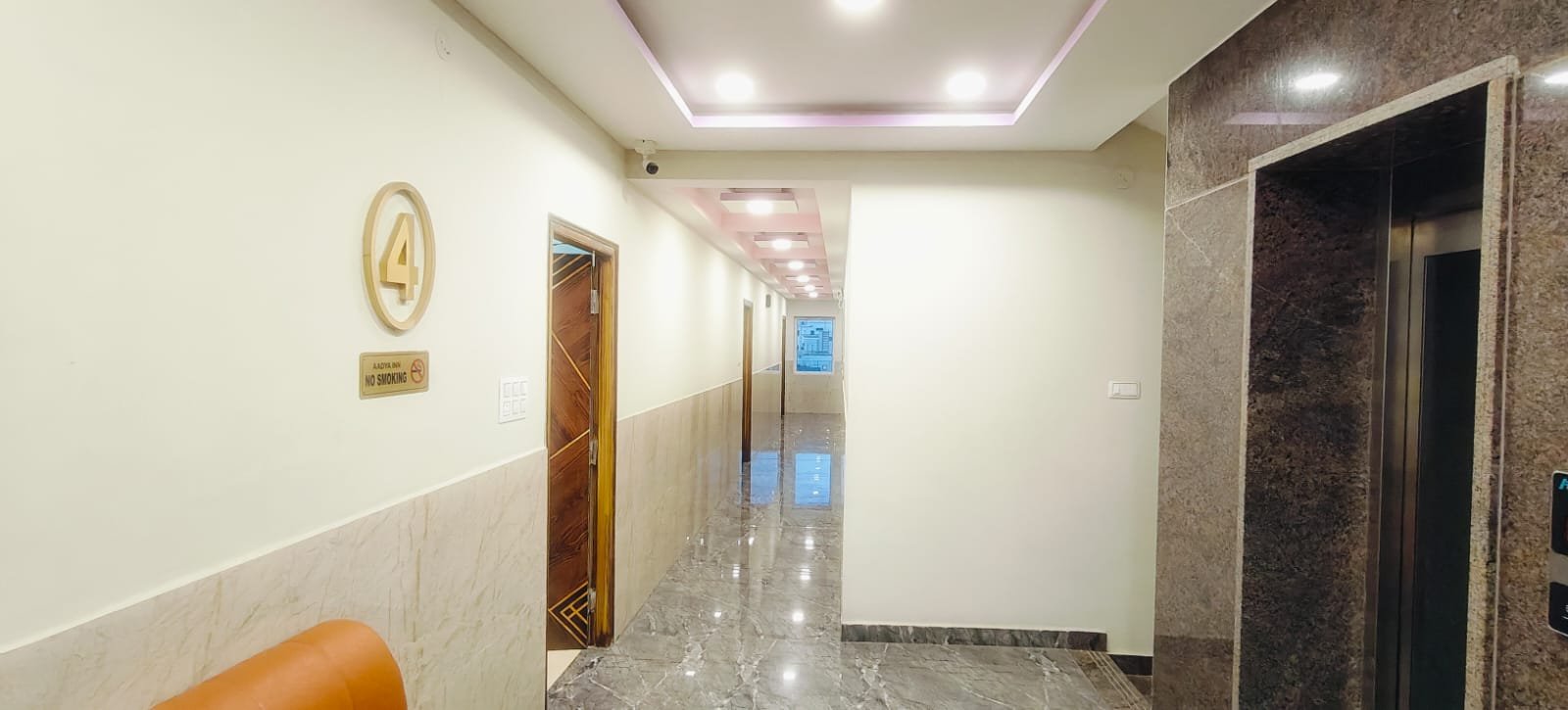 Fourth floor corridor and lift at Aadya Inn Tirupati