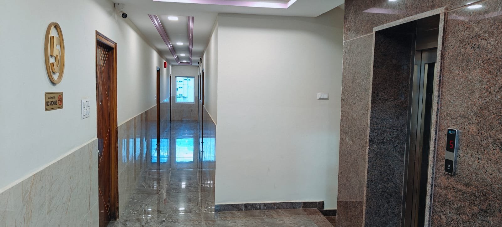 Fifth floor corridor and lift at Aadya Inn Tirupati