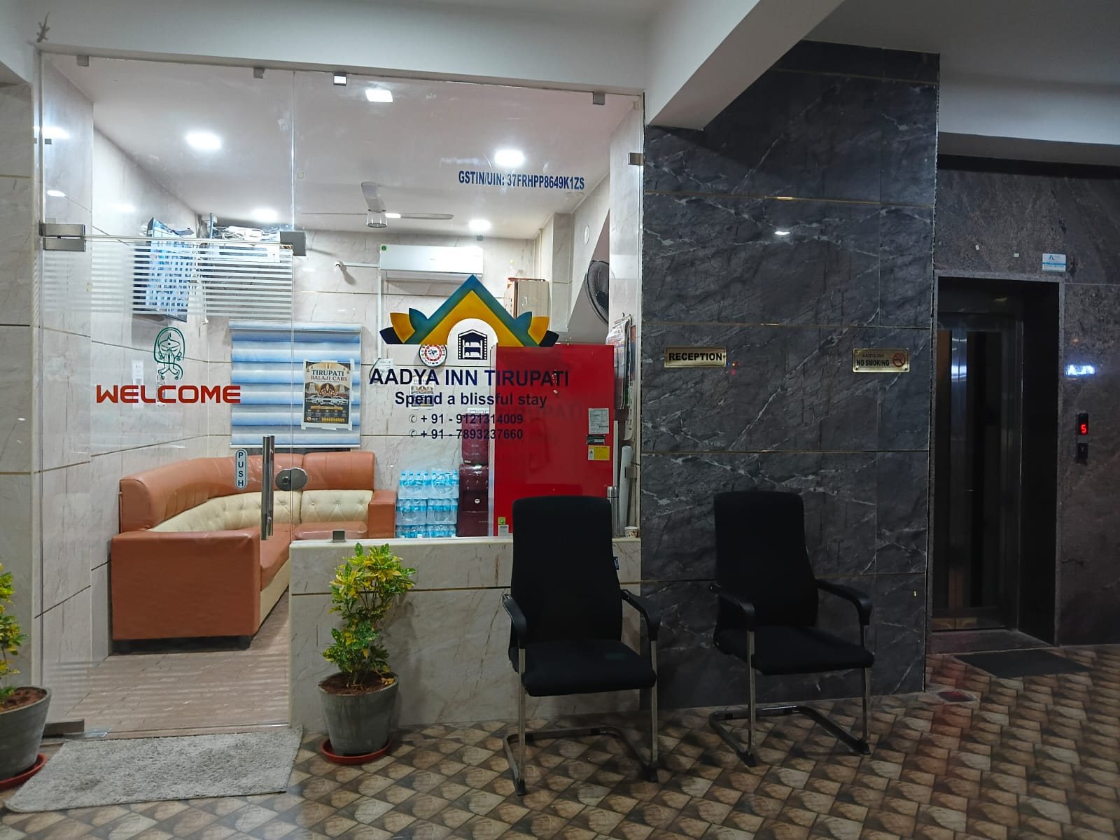 Front office entrance and lift lobby at Aadya Inn Tirupati